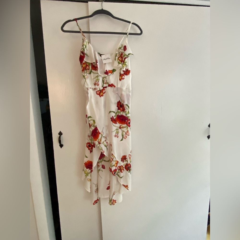 Hi-Low dress with built in shorts. Never worn.